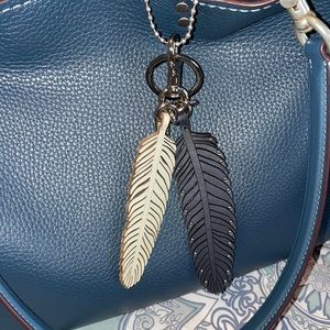 Coach feather charm